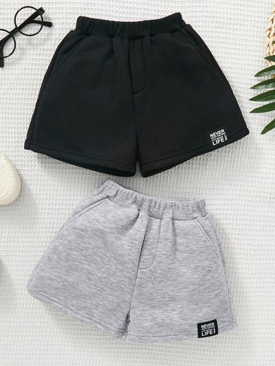 SHEIN Kids EVRYDAY Toddler Girls' Knit Solid Color Crop Top And Loose Fit Plaid Shorts Set