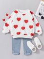 SHEIN Kids KDOMO Girls' Loose Fit College Style Heart Pattern Pullover Sweatshirt With Round Neck