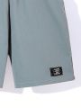SHEIN Kids SPRTY Tween Boys' Loose Fit Sporty Round Neck Pattern Print Short Sleeve T-Shirt And Shorts 2pcs/Set