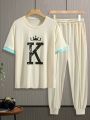 Manfinity Men's Letter Print Short Sleeve T-shirt And Long Pants Two Piece Set