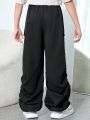 SHEIN Kids EVRYDAY Tween Boy Casual Patch Pocket Loose Trousers