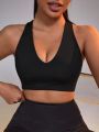 SHEIN Yoga Basic Women's Solid Color Hollow Out Back Athletic Bra With Phone Pocket