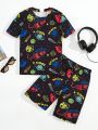 SHEIN Tween Boys' Casual Round Neck Short Sleeve T-Shirt And Shorts Set, Night Luminous Galaxy Element Printed, Knit Two Piece Set