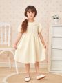 Young Girl Eyelet Embroidery Decor Puff Short Sleeve Dress With Ruffle Hem
