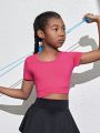 SHEIN Tween Girls' Knitted Solid Color Short Sleeve Sports T-Shirt With Hollow Out Back And Crossed Waist