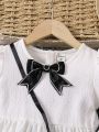 SHEIN Kids FANZEY Young Girl's Color Block Puff Sleeve Dress With Bow Decoration