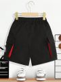SHEIN Kids Cooltwn Young Boy's Casual And Comfortable Color Block Shorts With English Letter Printing And Patch Pockets