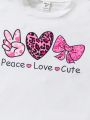 SHEIN Kids QTFun Tween Girls' Heart & Letter Printed Short Sleeve T-Shirt And Wavy Printed Shorts Set