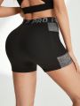 Letter Tape Contrast Color Sport Shorts With Phone Pocket