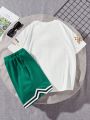 SHEIN Kids HYPEME Tween Boy's Casual Streetwear Style Letter Print Round Neck Short Sleeve T-Shirt And Knitted Shorts With Tape Two-Piece Outfit