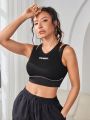 Letter Graphic Contrast Piping Sports Bra