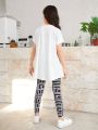 SHEIN Kids KDOMO Tween Girls' Loose Round Neck T-Shirt With Slim Fit Geometric Print Pants Casual Two Piece Set