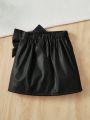 SHEIN Kids CHARMNG Girls' Comfortable Solid Color Pu Skirt With Bow Decoration For Casual Occasions