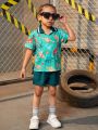 SHEIN Kids SUNSHNE Little Boys' Cartoon Animal Printed Top And Solid Color Shorts Set