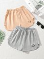 SHEIN Kids EVRYDAY Tween Girls' Loose Fit Knitted Solid Color Shorts With Smiling Face Embroidery For Spring And Summer