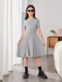 SHEIN Tween Girls' Sporty Chic Knit Solid Color Short Sleeve Dress With Round Neck, Irregular Hem