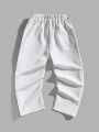 SHEIN Kids EVRYDAY Tween Boy's Casual Loose-Fit Knit Jogger Pants With Side Seam And Woven Tape Decoration