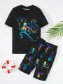 SHEIN Tween Boy Casual Night Luminous Skull Print Round Neck Pullover Short Sleeve Top And Shorts Tight Home Clothes Set