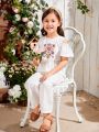 SHEIN Kids QTFun Young Girls' Round Neck Off-Shoulder Ruffle Sleeve Embroidery Jumpsuit
