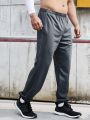 SHEIN Running Men's Solid Color Elastic Waist Jogger Pants With Slanted Pockets