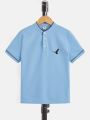 SHEIN Teen Boys' Casual Bird Printed Stand-Up Collar Short Sleeve Polo Shirt For Summer