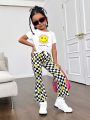 SHEIN Kids Cooltwn Street-Style Young Girl's Cool Knitted Round Neck Short Sleeve Top With Face Design And Checkerboard Flare Pants Set, Spring/Summer