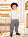 SHEIN Kids Nujoom Young Boy Solid Color Woven Fitted Casual Pants
