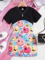 SHEIN Kids QTFun 2pcs/Set Tween Girls' Cool Black Round Neck Short Sleeve T-Shirt And Smiling Face Print Sleeveless Cami Romper Set