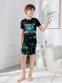 SHEIN Tween Boy Tight-Fitting Casual Round Neck Short Sleeve T-Shirt And Shorts With Glow-In-The-Dark Slogan And Game Console Print, 2pcs Homewear Set