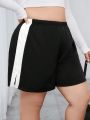 SHEIN Essnce Plus Size Color Block Shorts