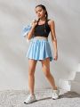 SHEIN Teenage Girls' Knit Solid Color Sports Skirt With Anti-Light Inner Shorts