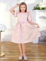 SHEIN Kids FANZEY Tween Girls' Round Neck Jacquard Dress With Puff Sleeves And Bow Decorations