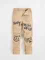 SHEIN Tween Boy Graffiti Print Ripped Jeans