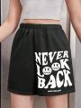 SHEIN Teenage Girls' Knit Pure Color Shorts With Slogan Print And Diagonal Pockets