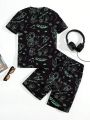 SHEIN Boys' Casual Street Style Astronaut Theme Short Sleeve Tee And Shorts Pajamas Set With Glow-In-The-Dark Print