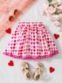 SHEIN Kids EVRYDAY Little Girls' Casual Heart Shaped Printed Skirt With Pom Pom Detail At Hem