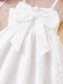 SHEIN Kids EVRYDAY Little Girl's Textured Fabric Spaghetti Strap Dress With Bow Decoration