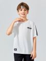 SHEIN Tween Boys Loose Fit Casual Round Neck Short Sleeve Sports T-Shirt With Letter Print