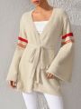 S Essence Women'S Striped Bell Sleeve Sweater