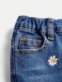 SHEIN Young Girls' High-Waisted Stretchy Floral Embroidery Flare Jeans, Water Washed Denim Fabric