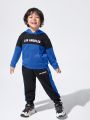 JNSQ Toddler Boys' Casual Loose Fit Hooded Sweatshirt With English Letter Print And Side Color Block Jogger Pants Set