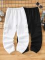 SHEIN Kids EVRYDAY Teen Boys' Casual Streetwear Style Two-Piece Outfit: Elastic Waist Flap Pocket Side Stripe Sweatpants And T-Shirt