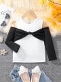 SHEIN Kids FANZEY Little Girls' Black And White Splicing Bowknot Decor Long Sleeve T-Shirt