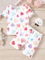 SHEIN Young Girls' Knitted Heart Pattern Tight-Fit Round Neck Top And Shorts Homewear Set