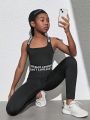 SHEIN Tween Girls' Knitted Pure Color Spliced Letter & Ribbon Decor Tank Top And Pants Sportswear Set