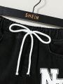 SHEIN Tween Boy Letter Graphic Drawstring Waist Ripped Jeans