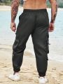 Manfinity Loose Fit Men's Cargo Pants With Flap Pockets, Side Drawstring Waist