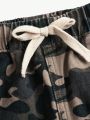 SHEIN Tween Girls' Camouflage Pattern Ripped Jeans