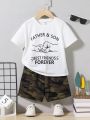 SHEIN Kids QTFun Toddler Boys' Comfortable Casual Father'S Love Theme Printed Short Sleeve Top And Camouflage Printed Shorts Set
