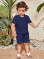 SHEIN Baby Boy Casual And Comfortable Button-Front Half Placket Short Sleeve Shirt And Shorts Outfits